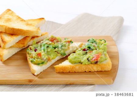 toasted bread with guacamole toasted bread with guacamole 38463681