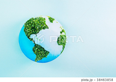 Earth model made of paper and fresh green sprouts 38463858