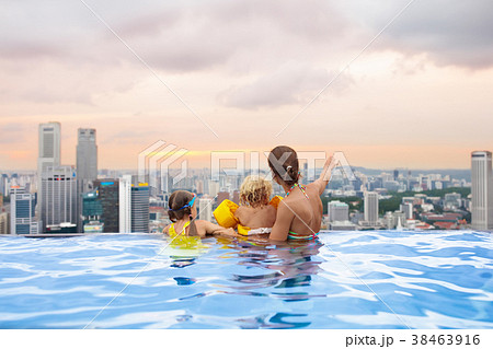 Kids swim in Singapore roof top swimming pool 38463916