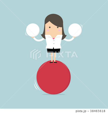 Businesswoman balancing on red ball holding sphere 38465618