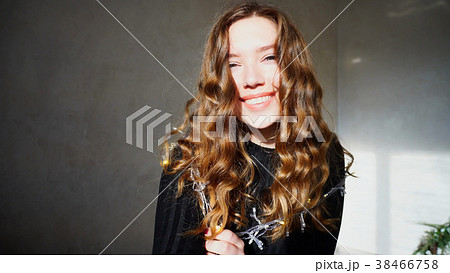 Young Female Smiling, Looking at Camera with curly 38466758