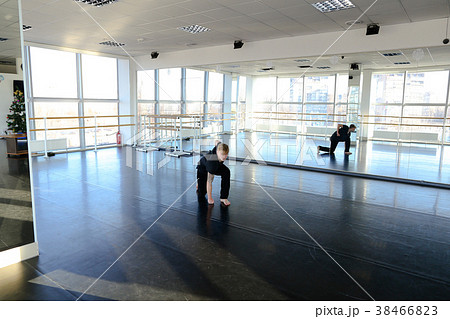 Young boy doing hand stretching at dancing studio. Young boy doing hand stretching at dancing studio. 38466823