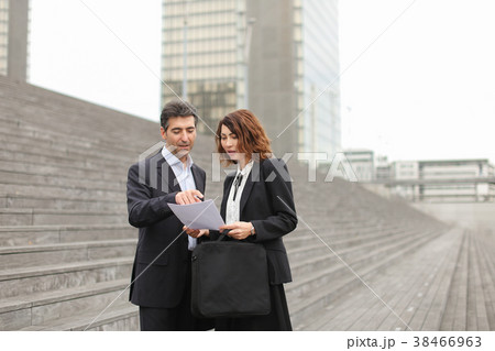 male lawyer speaking with female client. male lawyer speaking with female client. 38466963