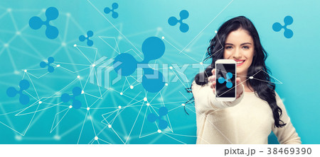 Ripple with young woman holding out a smartphone 38469390