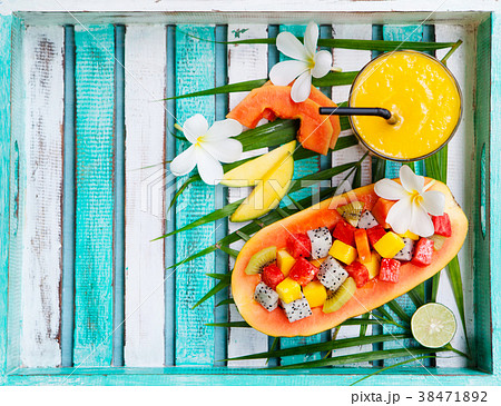 Tropical fruit salad in half of papaya mango juice 38471892