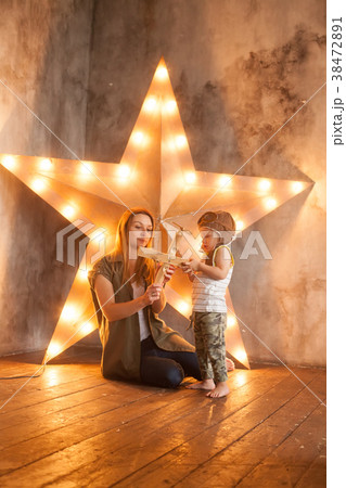 Young Mother and her Child Boy on Studio  38472891