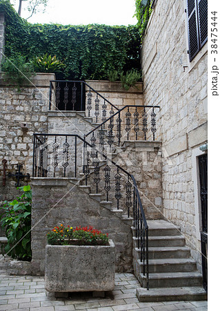 staircase with iron railings and flowers in staircase with iron railings and flowers in 38475444
