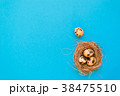 Spotted quail eggs in a straw nest  38475510