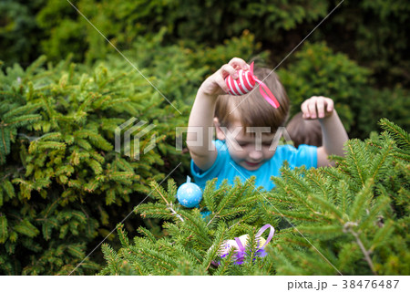 Kids on Easter egg hunt in blooming spring garden. Kids on Easter egg hunt in blooming spring garden. 38476487