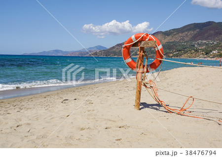 Life preserver on sandy beach somewhere near at Life preserver on sandy beach somewhere near at 38476794