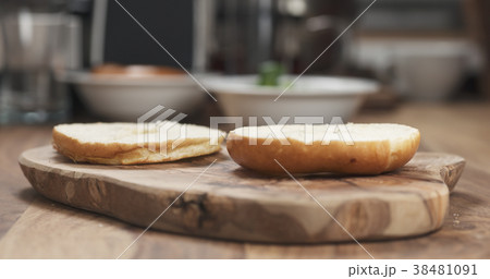 sliced bagel on wood board sliced bagel on wood board 38481091