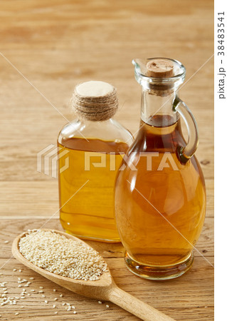 Kitchen still life of glass oil jars and scoop Kitchen still life of glass oil jars and scoop 38483541