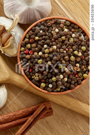 Composition of powder spices on spoon and 38483696