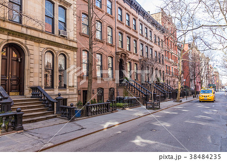 Scenic tree lined street of historic brownstone Scenic tree lined street of historic brownstone 38484235