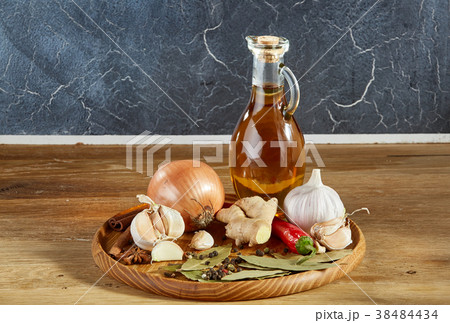 Conceptual composition of different spices and oil 38484434