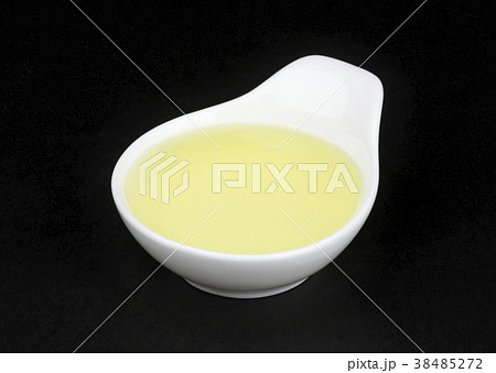Vinegar in white bowl isolated on black background 38485272