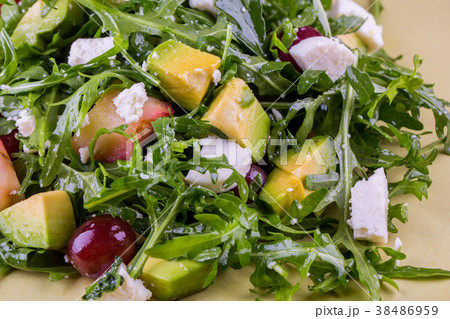 Mango, grapes, cheese of a fetaks with arugula, sa 38486959