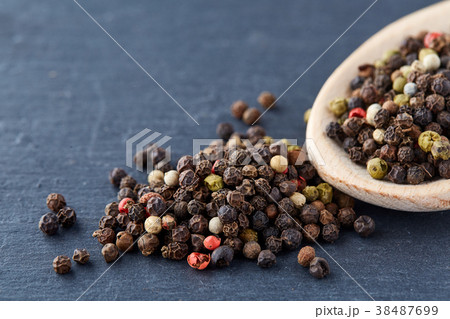 Top view on composition of peppercorns in wooden 38487699