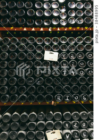 Bottles with wine in the wine cellar Bottles with wine in the wine cellar 38488995