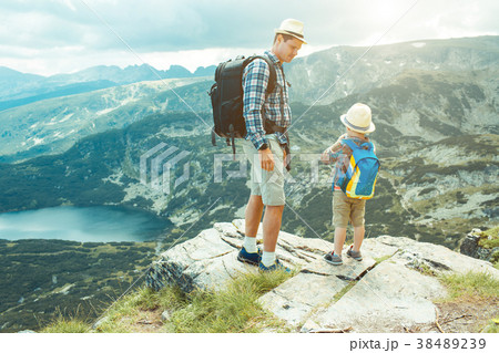 Father and son traveling in Rila mountains 38489239