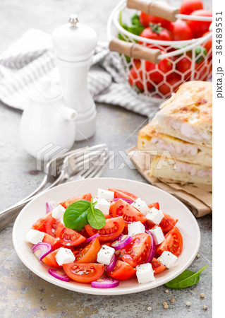 Tomato salad with feta cheese. Healthy eating Tomato salad with feta cheese. Healthy eating 38489551