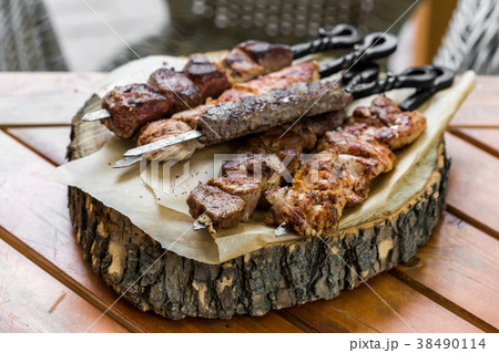 Barbecue meat. Grilled pork skewers on plate Barbecue meat. Grilled pork skewers on plate 38490114
