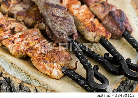 Barbecue meat. Grilled pork skewers on plate 38490115