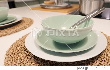 Set of Porcelain Plates, Bowls and Silverware 38490230