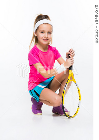 Cute little girl with tennis racket in her hands Cute little girl with tennis racket in her hands 38490570