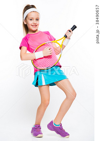 Cute little girl with tennis racket in her hands Cute little girl with tennis racket in her hands 38490657