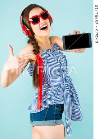 Young sexy woman with headphones and cellphone 38492710
