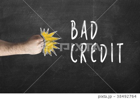 fist beats Bad Credit written on chalkboard. fist beats Bad Credit written on chalkboard. 38492764