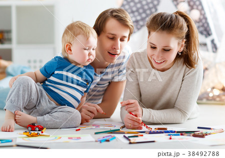 children's creativity. happy family mother father and   son draw 38492788