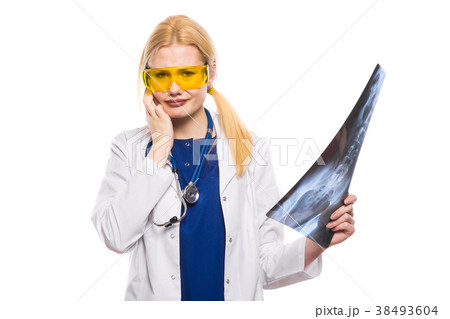 Woman doctor in white coat with X-ray Woman doctor in white coat with X-ray 38493604