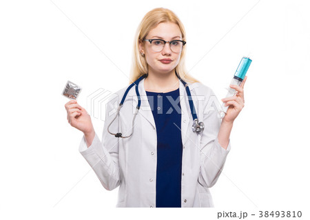 Woman doctor hold condom and injection Woman doctor hold condom and injection 38493810