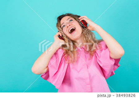 Woman DJ in shirt with headphones 38493826
