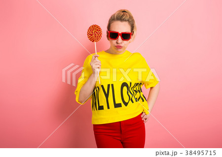 Young attractive womal with lollipop 38495715