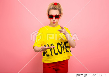 Blonde woman in bright clothes Blonde woman in bright clothes 38495786