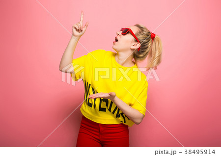 Blonde woman in bright clothes Blonde woman in bright clothes 38495914