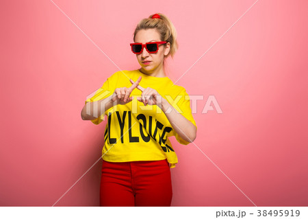 Blonde woman in bright clothes Blonde woman in bright clothes 38495919