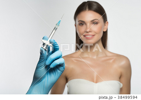 Cheerful lady is ready for collagen injection 38499594