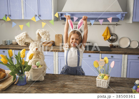 Enjoyed kid playing easter game indoors Enjoyed kid playing easter game indoors 38500361