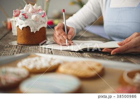 Girl arms writing in the kitchen 38500986