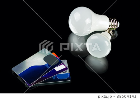 energy-saving LED bulb and credit cards energy-saving LED bulb and credit cards 38504143
