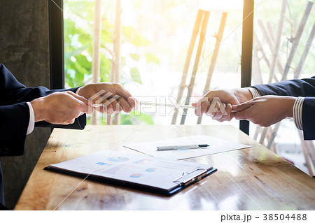 two businessmen playing tug of war Teams struggleing to win, Bus two businessmen playing tug of war Teams struggleing to win, Bus 38504488