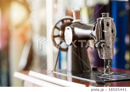 Old sewing machine and item of clothing Old sewing machine and item of clothing 38505441
