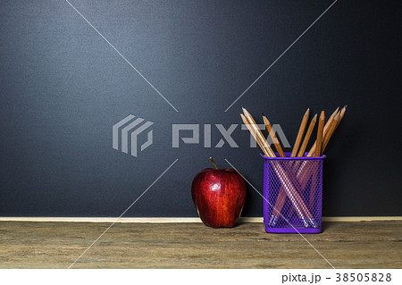 Education concept. Pencil and red apple on table Education concept. Pencil and red apple on table 38505828