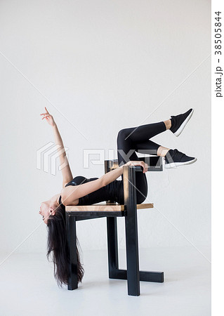 The sports attractive flexible woman in sportwear 38505844