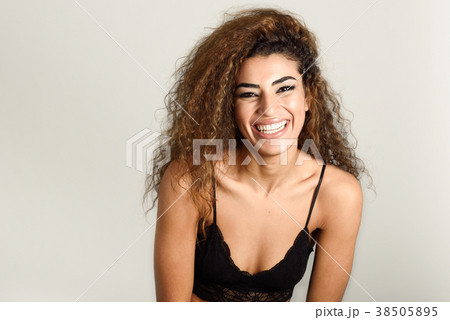 Young caucasian woman posing in blue bra and jeans Stock Photo by javi_indy