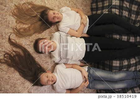 Portrait of young woman and two female teenagers Portrait of young woman and two female teenagers 38510419